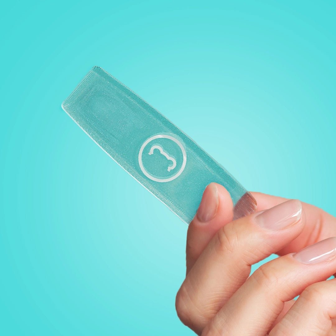 SugarbearPRO Limited Edition Travel Essentials - SugarbearPRO® Glass travel nail file being held, part of the travel beauty kit.